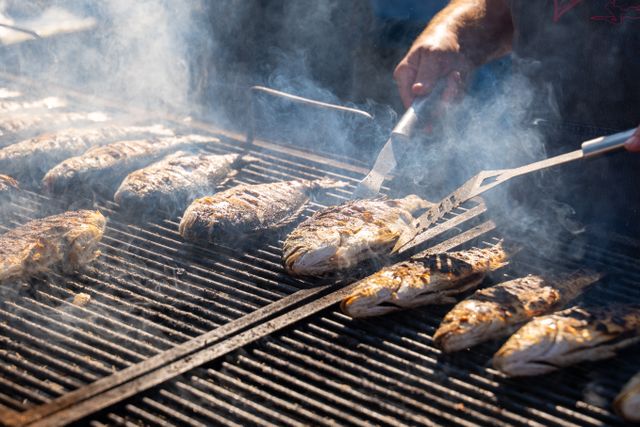 Fish fillets grilling on a barbecue